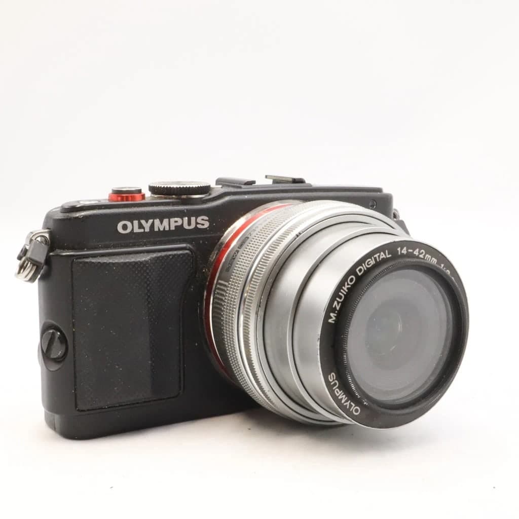Olympus PEN Lite E-PL5 with attached silver lens